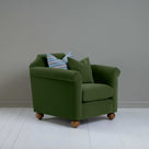  Dolittle Armchair in Intelligent Velvet Juniper, Side View With 1 Matching and 1 Slow Lane Cotton Linen, Blue Cushion - Nicola Harding 