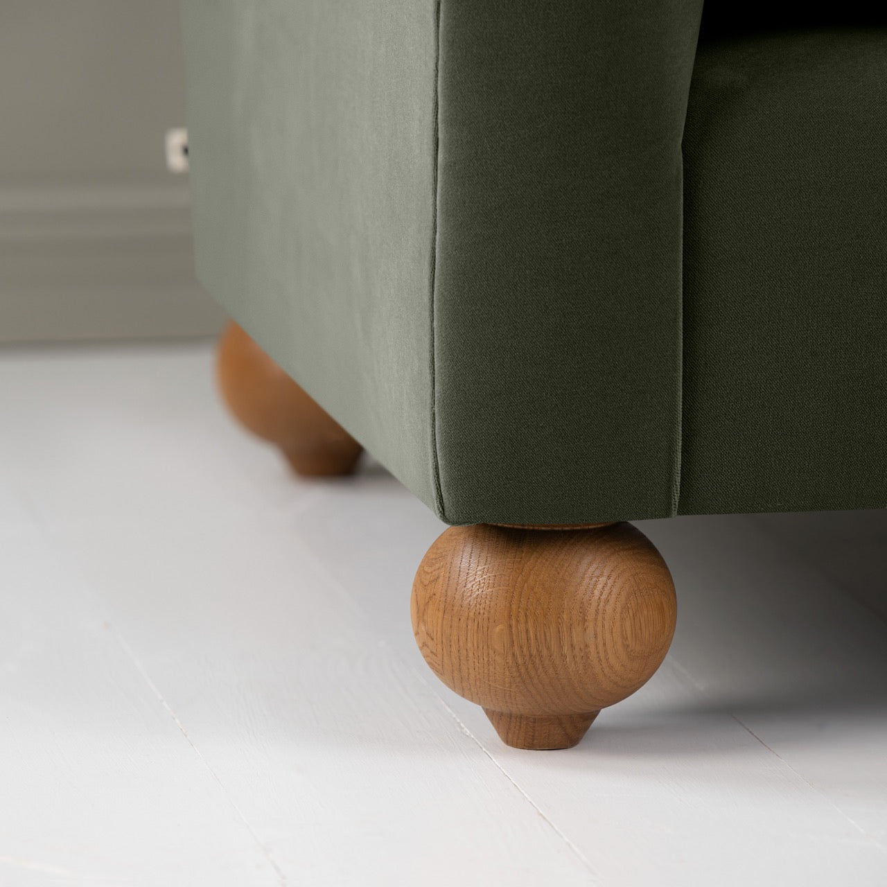  Dolittle Armchair in Intelligent Velvet Seaweed, Round Wooden Foot Closeup - Nicola Harding 