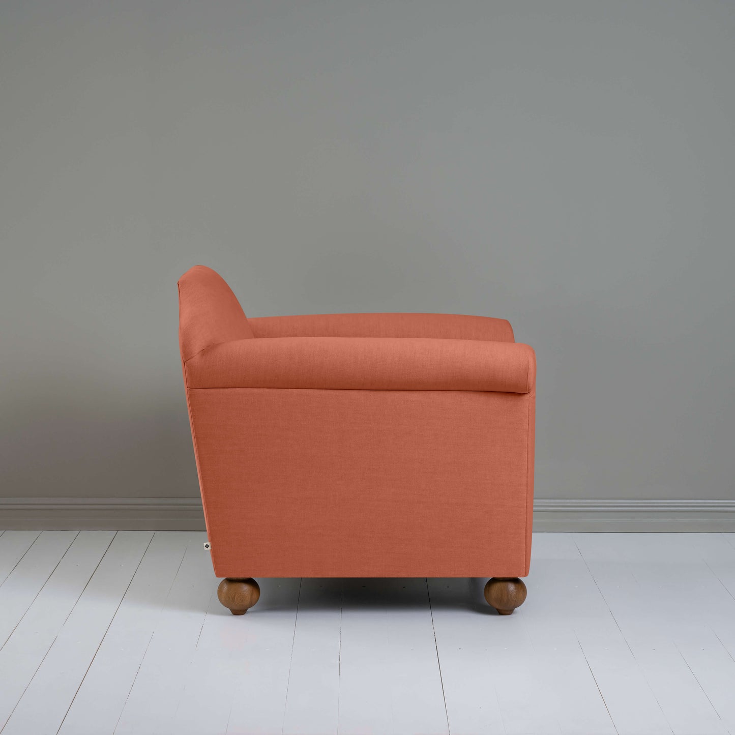 Dolittle Armchair in Laidback Linen Cayenne, Side View - Nicola Harding