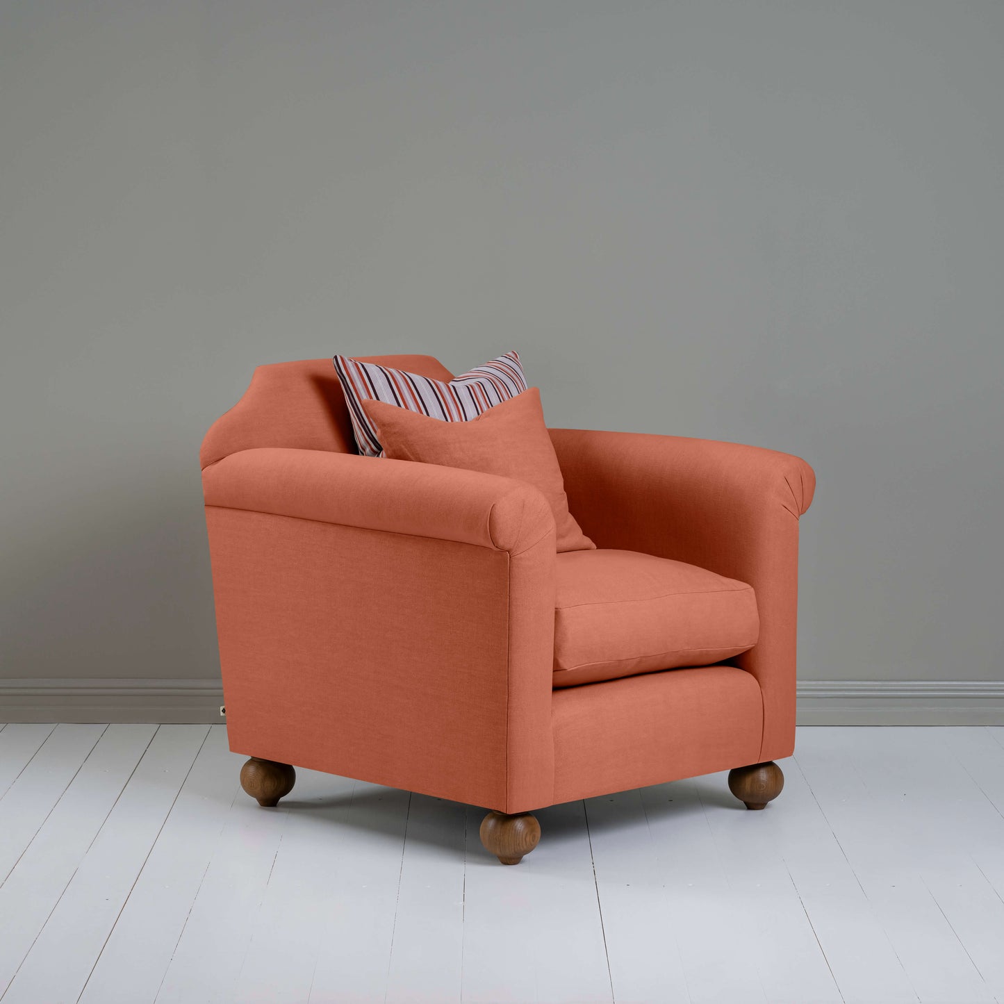 Dolittle Armchair in Laidback Linen Cayenne, In Side View With 2 Special NiX Cushions - Nicola Harding