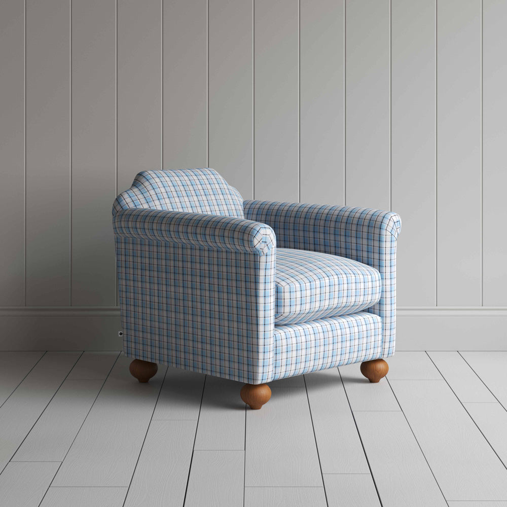 A close-up of a blue and white checkered sofa, showcasing its intricate pattern and inviting texture.