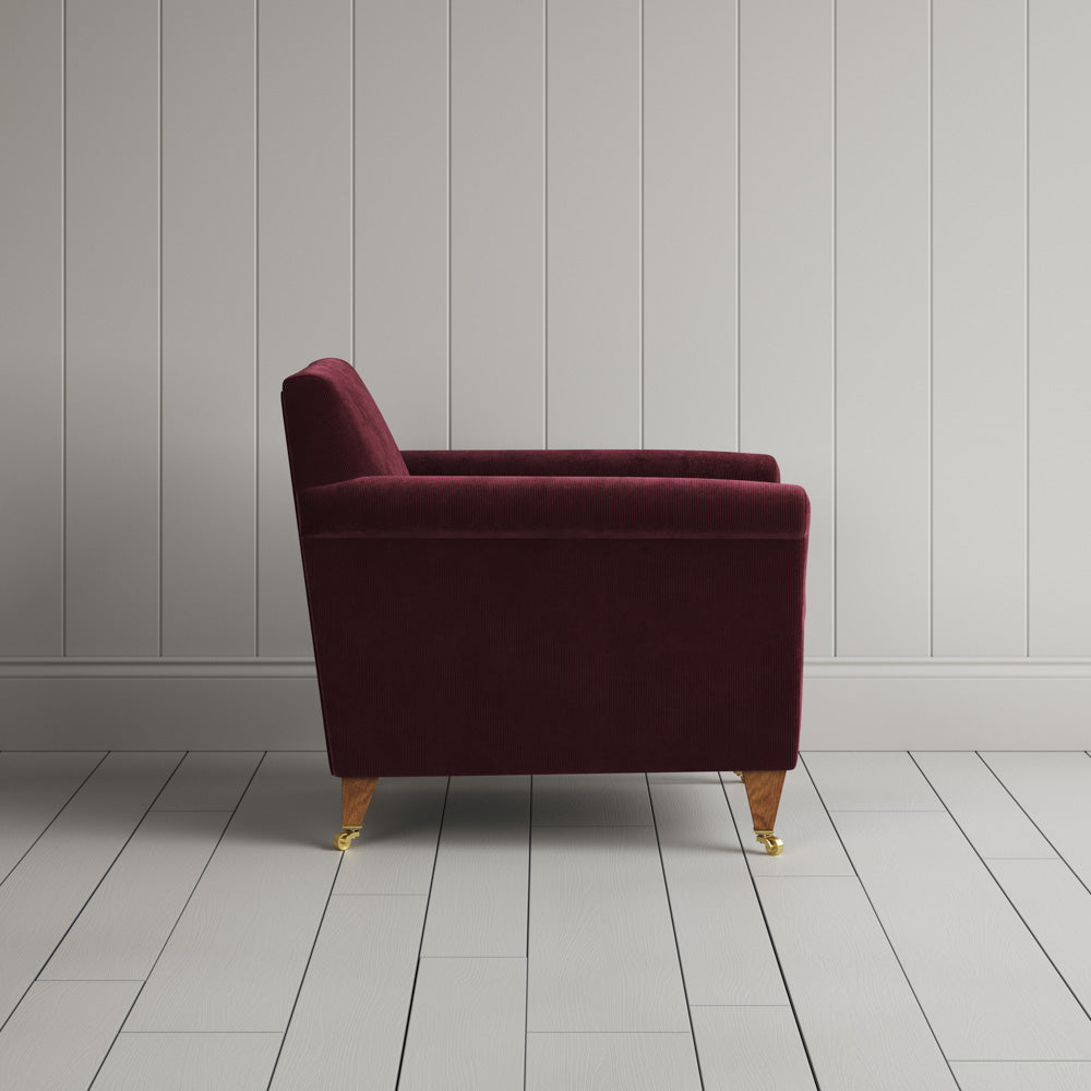  Side profile of the Cherry corduroy Idler armchair, an elegant Edwardian-style occasional chair. 