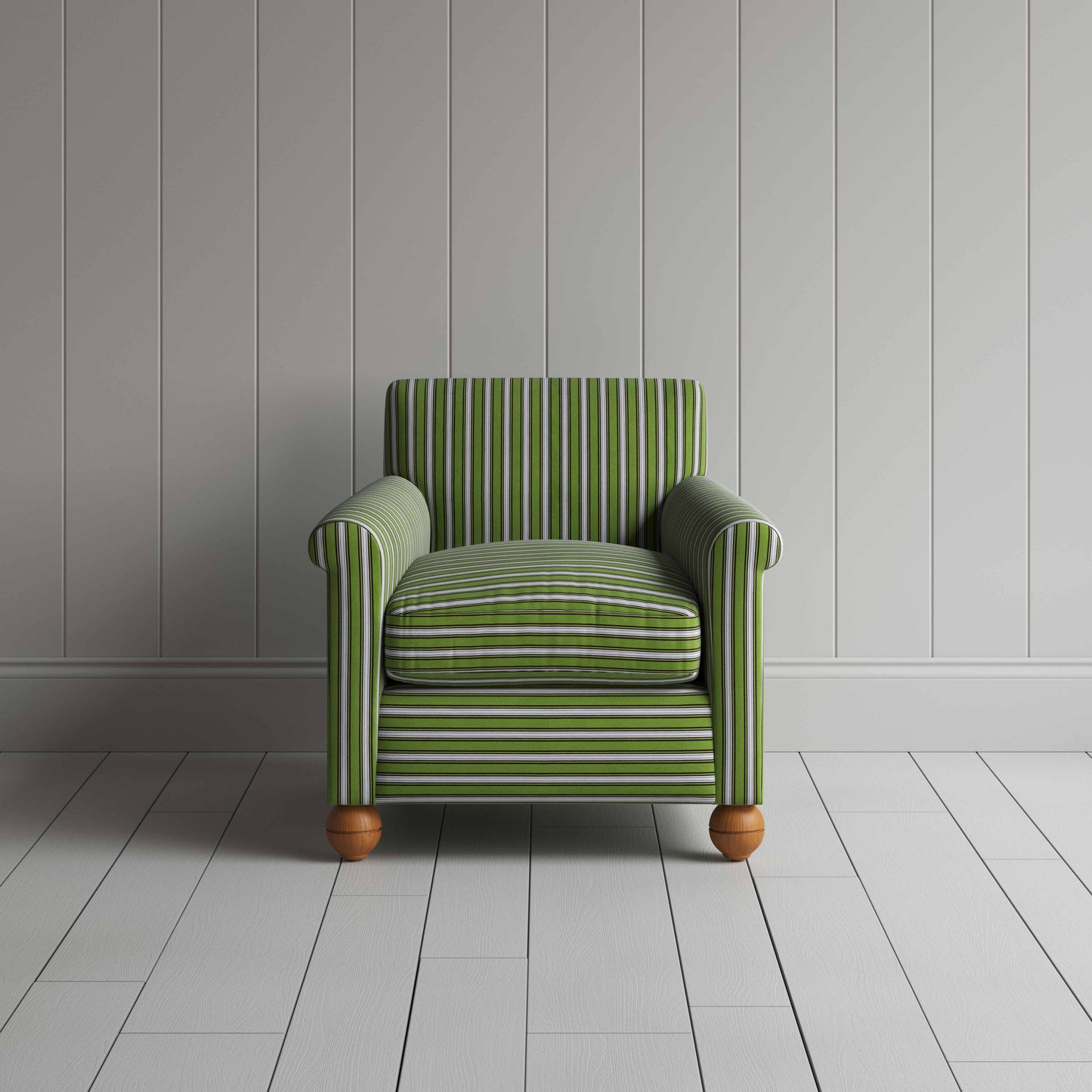 A green and white striped couch against a wall.