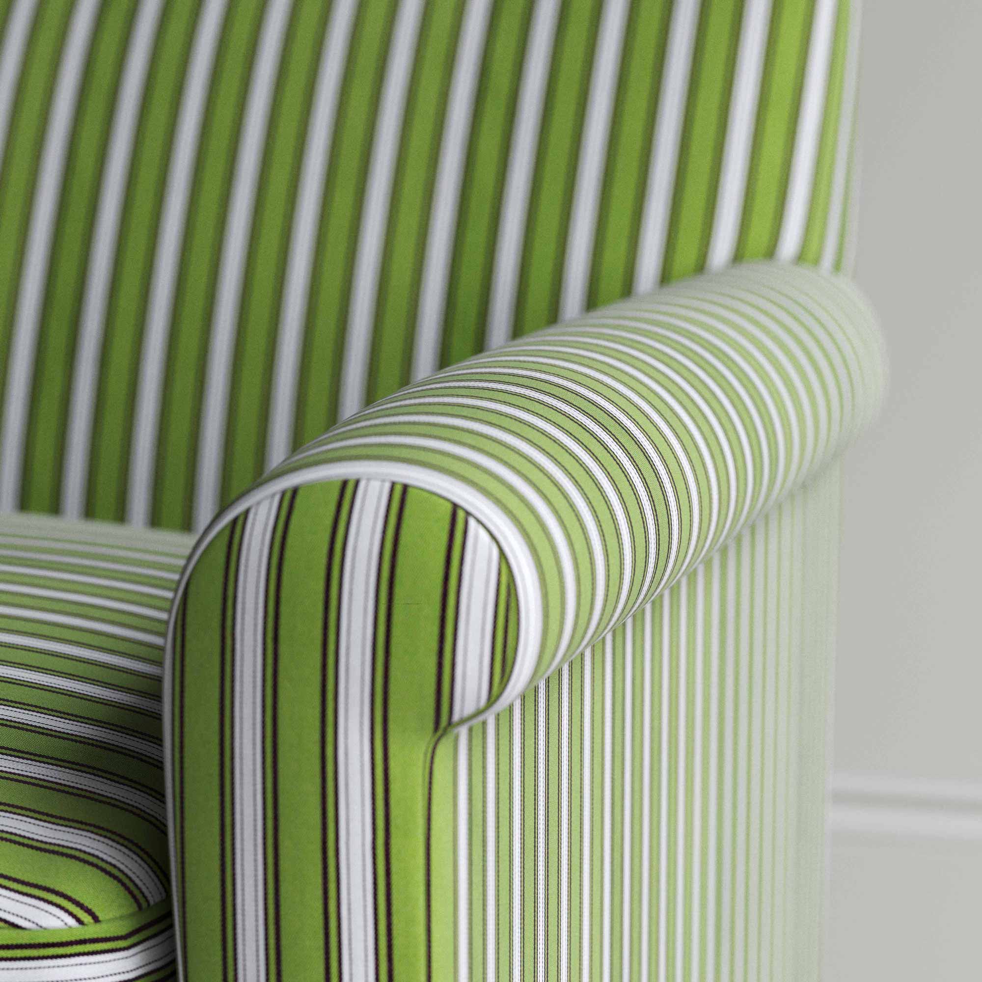  Detailed view of a green and white striped sofa. 