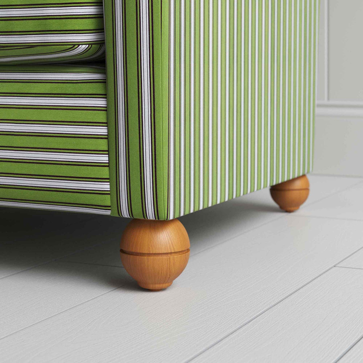 A close-up of a green and white striped chair, adding a touch of elegance and vibrancy to any room.