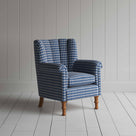  Blue and white checkered armchair, adding a touch of elegance and comfort to any living space. 