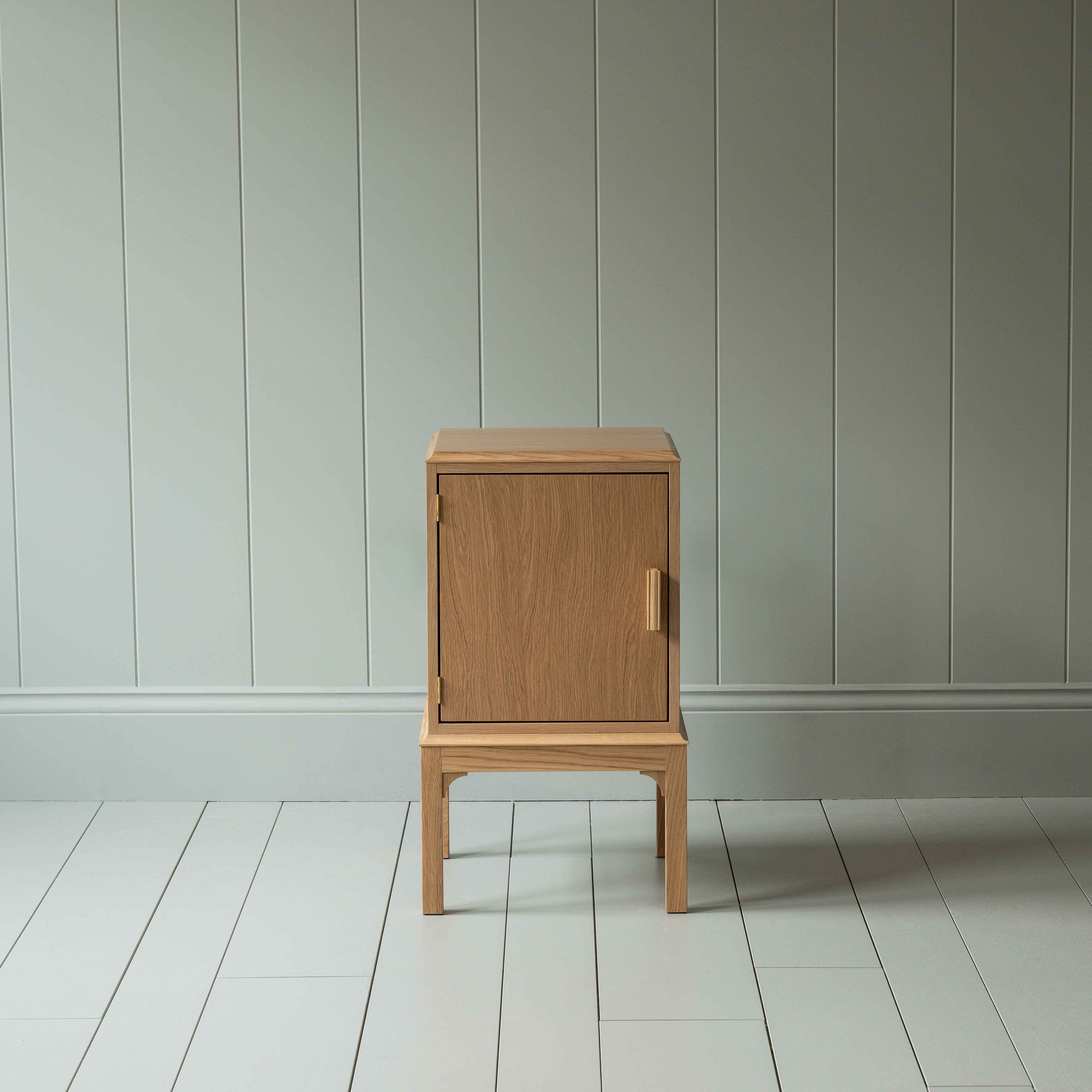  Front View of Bits and Bobs Bedside Table, Natural Oak, Left Hand Side - Nicola Harding 