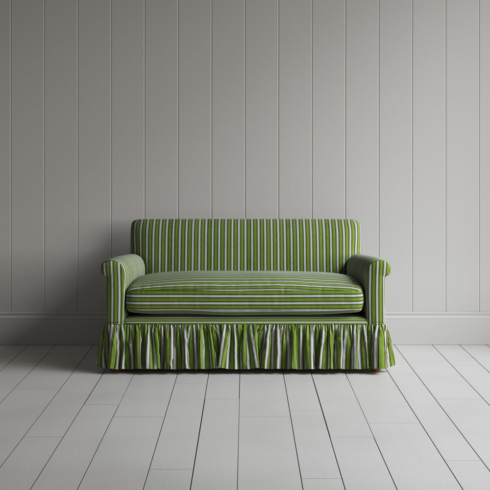 Front view of Curtain Call loveseat in green and wine Colonnade Cotton with ruffled skirt
