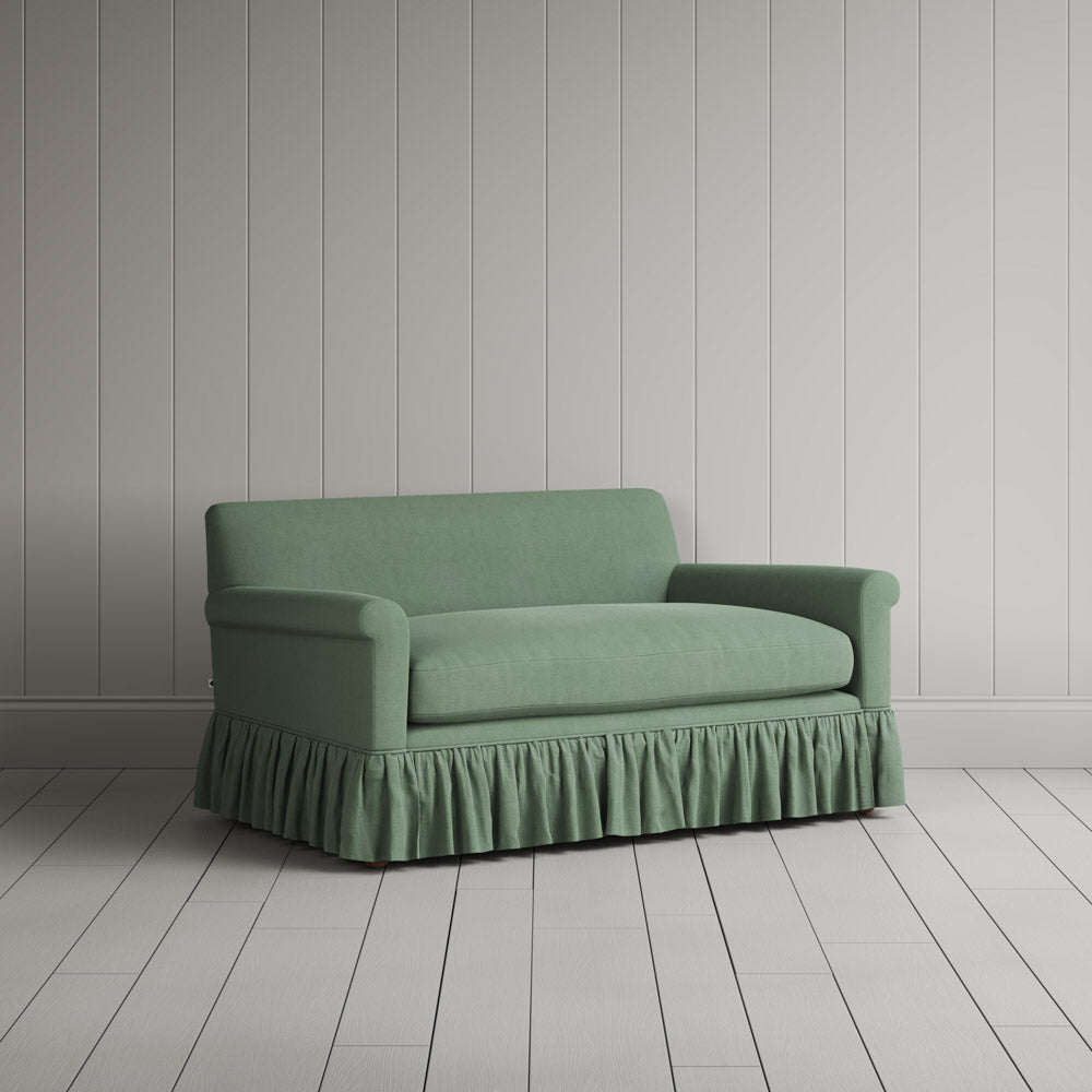  Three-quarter view of the Laidback Linen Moss Curtain Call love seat by NiX. 