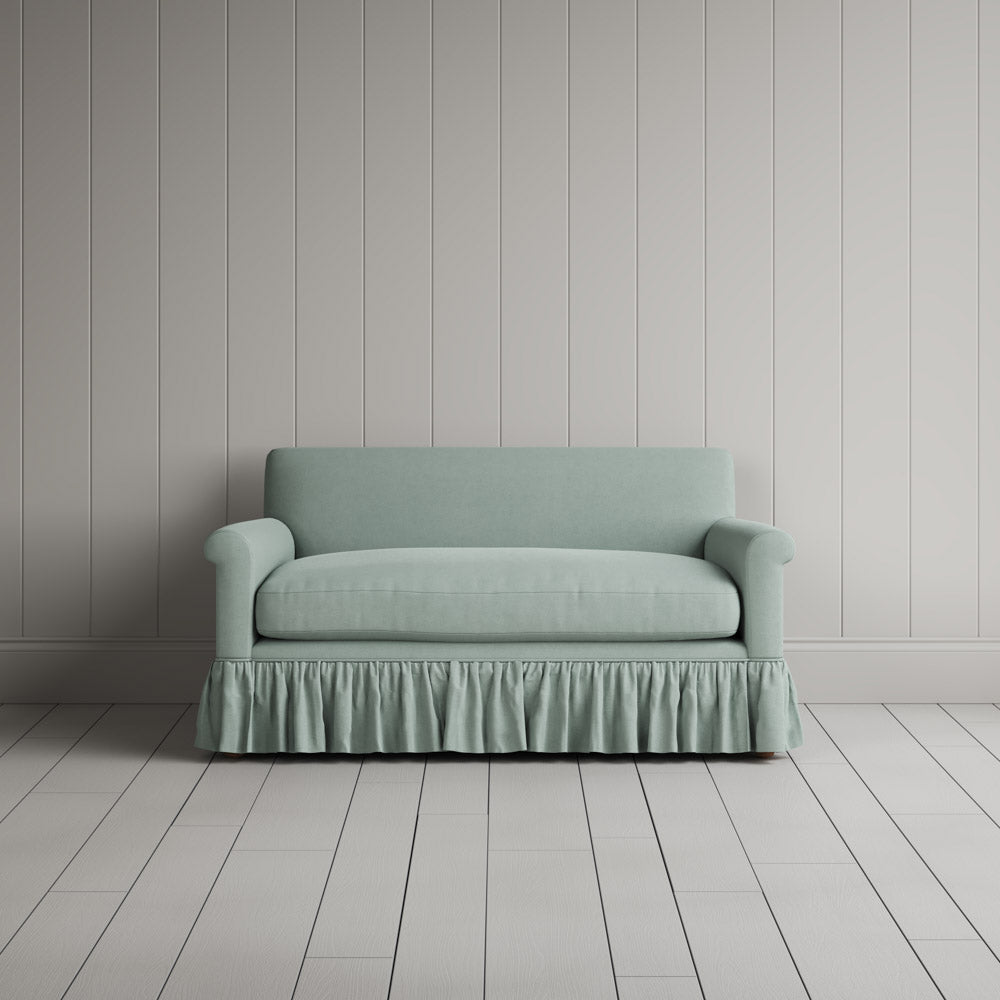  Front portrait of the Laidback Linen Curtain Call love seat by Nicola Harding interiors. 