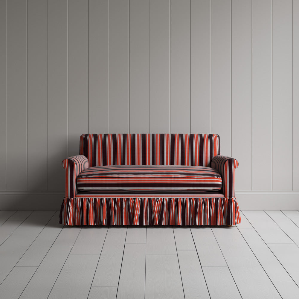  Front view of the flame cotton nix sofa highlighting its gathered skirt base. 