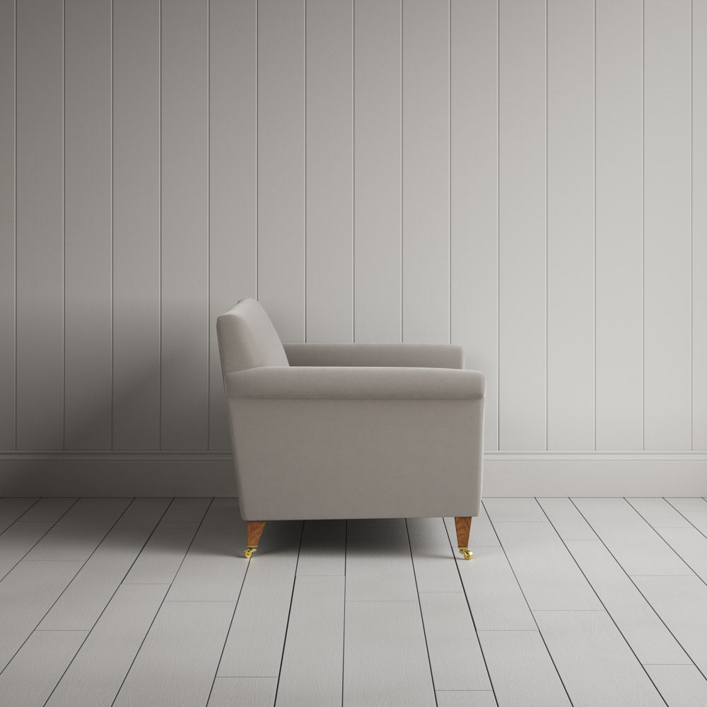  Side profile of the Idler seat in Moonstone Intelligent Velvet by Nix. 