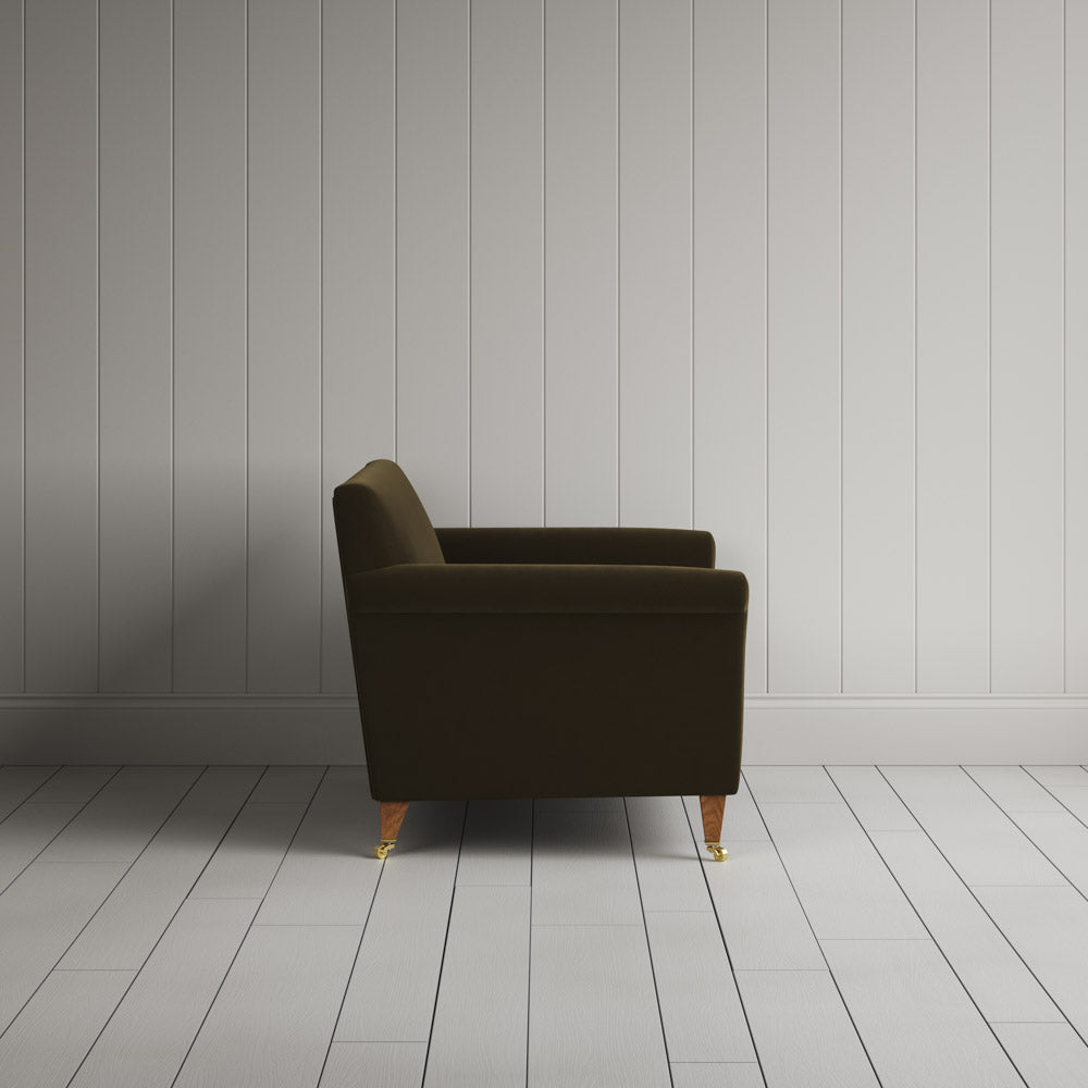  Side profile of the Idler seat in Seaweed Intelligent Velvet by Nix. 