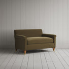 Side silhouette of the handcrafted Sepia velvet love seat by Nicola Harding.