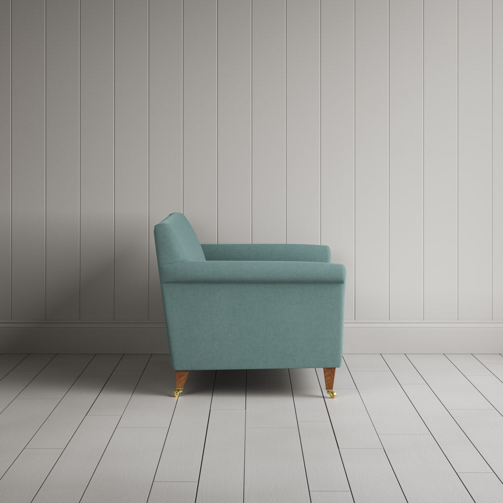  Side profile of the Idler seat in Cerulean Laidback Linen by Nix. 