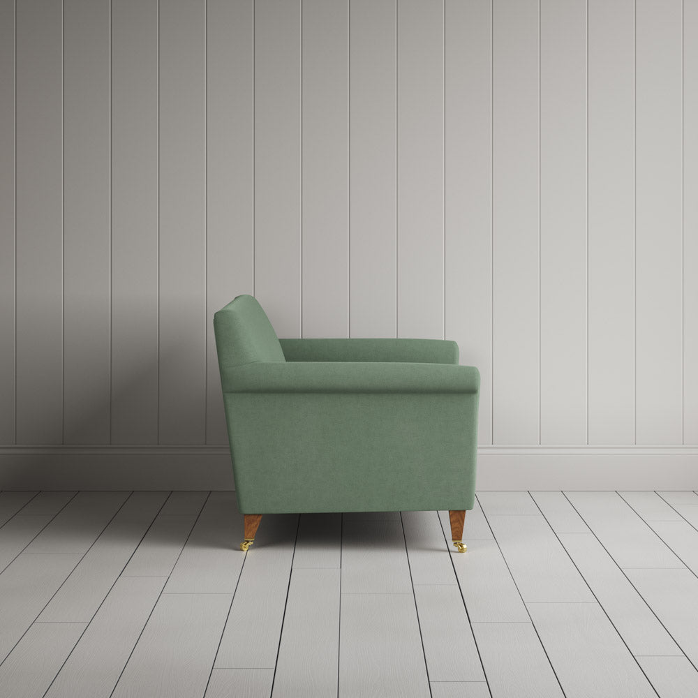  Side profile of the Idler seat in Moss Laidback Linen by Nix. 