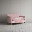 Angled view of the Berry Slow Lane cotton linen love seat by Nicola Harding.