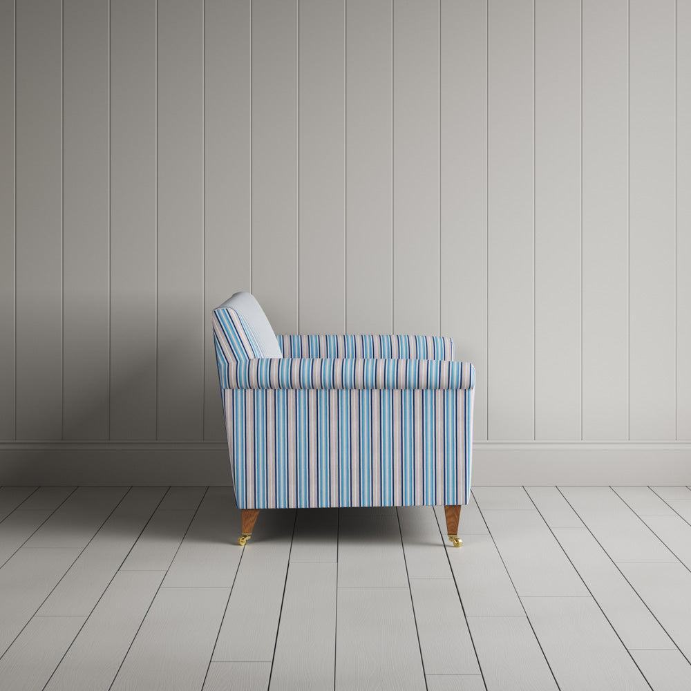 Side profile of the Idler seat in blue cotton linen showing its clean lines by Nix.