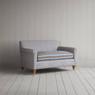 Angled view of the Ticking Blue Brown Idler love seat by NiX