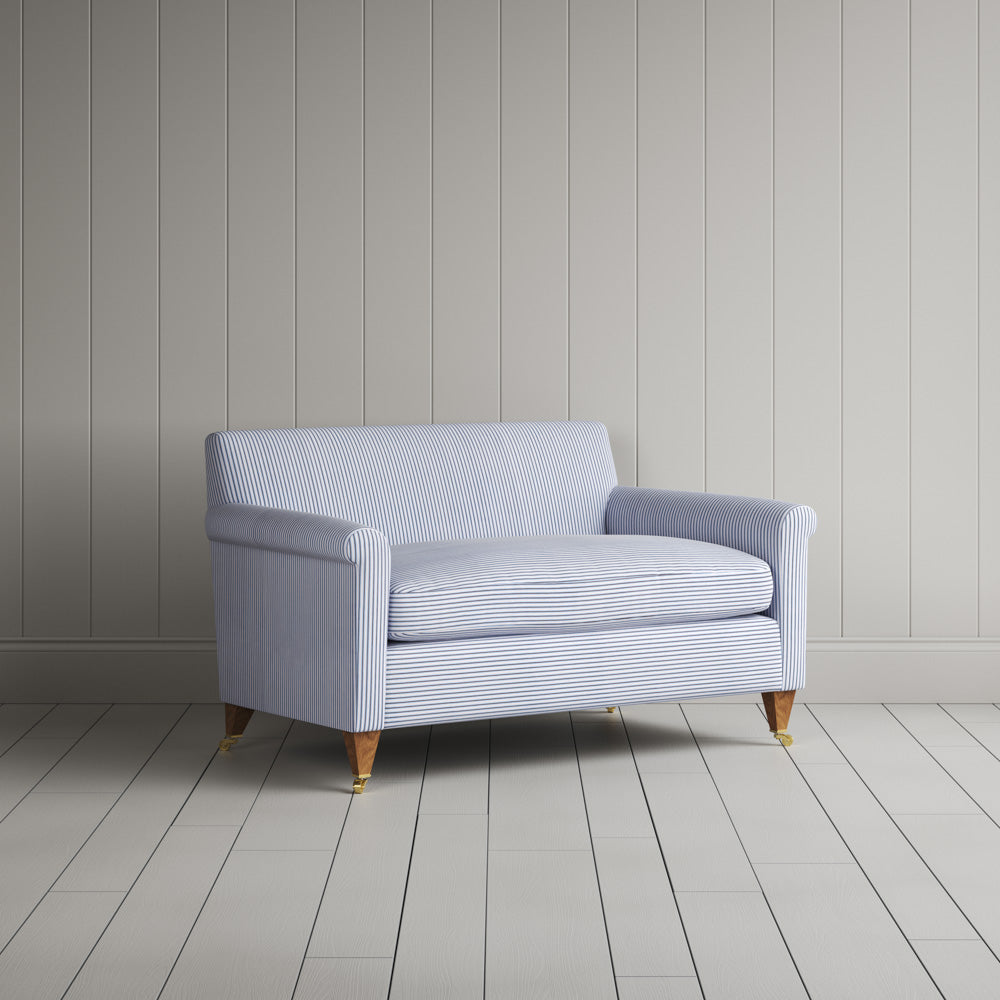  Angled view of the Aqua Brown ticking Idler seat by Nix. 