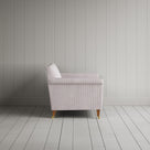 Side profile of the Berry ticking love seat revealing its sturdy handcrafted beech frame and timeless lines by Nix.