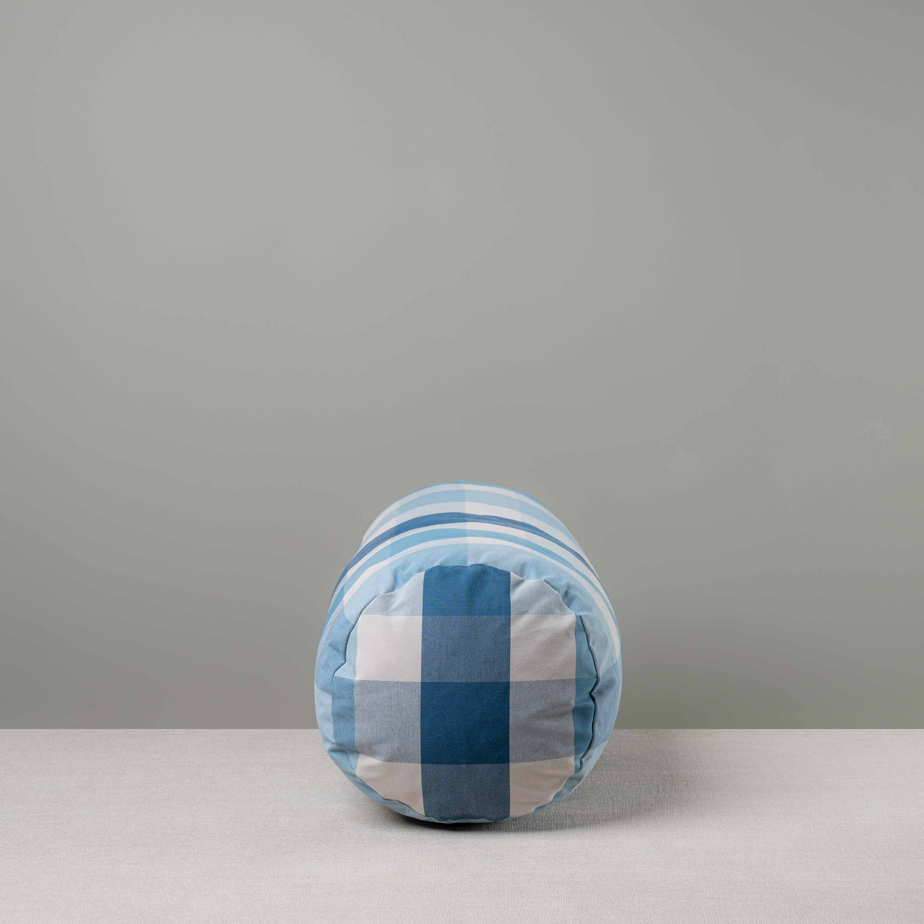  Side View of Bask Bolster Cushion in Checkmate Cotton, Blue - Nicola Harding 