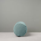  Side View of Bask Bolster Cushion in Intelligent Velvet, Mineral - Nicola Harding 