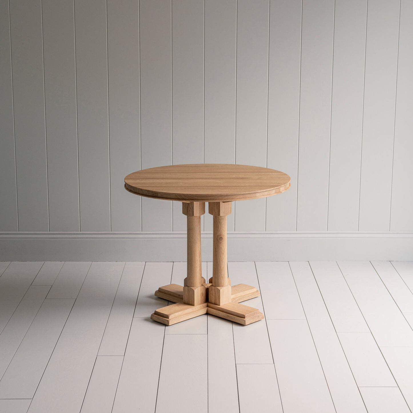 Small beautiful round oiled oak wood dining table, manufactured by NiX in London.