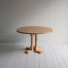  Round oiled oak wood dining table, manufactured by NiX in London. 