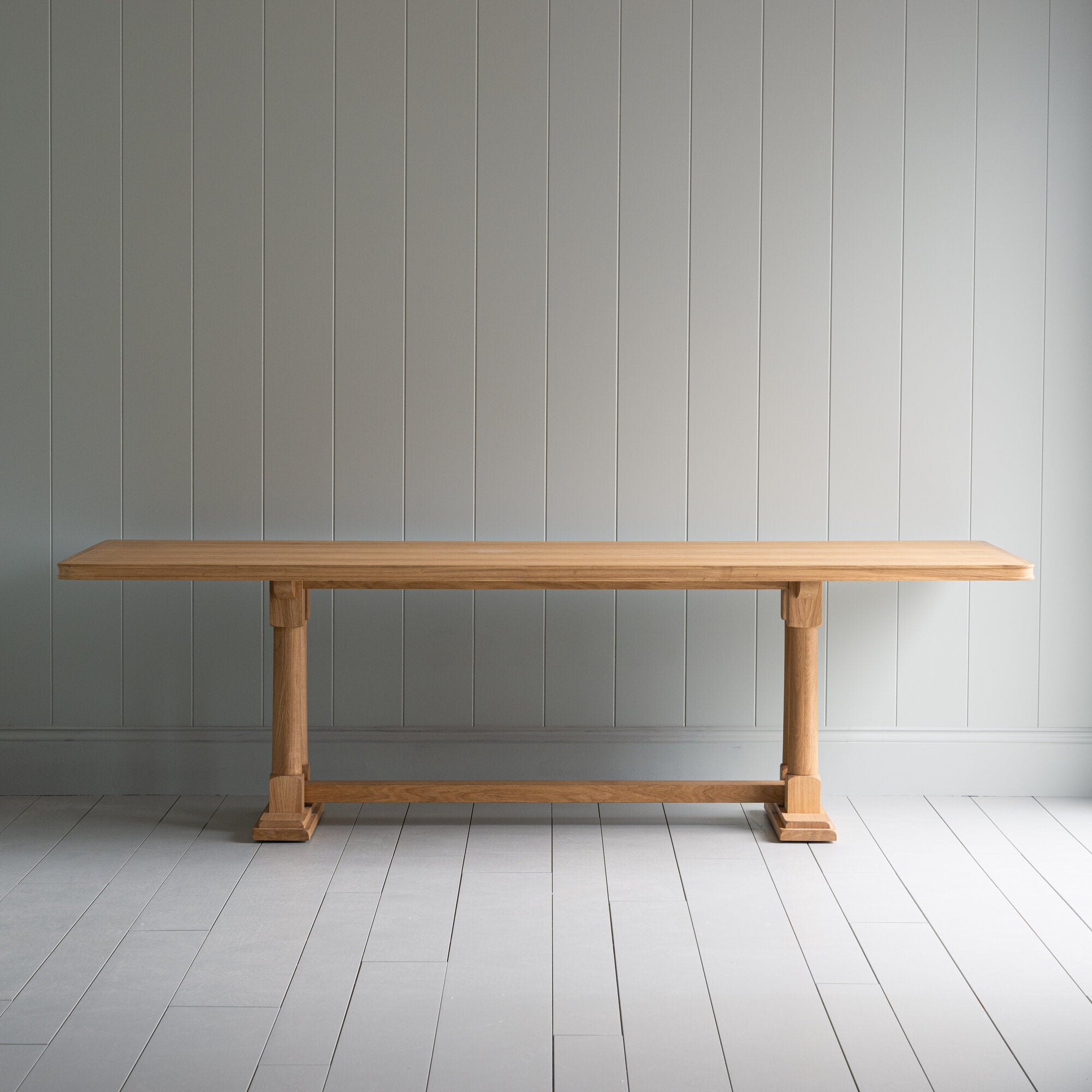  Side view of the Tuck In rectangular dining table in oak, manufactured by NiX. 