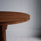 Edge design of the round Smoky Stained Oak Wood dining table, showcasing its smooth finish