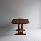  Side View of Tuck-In Oval Dining Table in Smoky Stained Oak - By NiX 