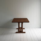  Side View of Tuck In rectangular dining table in smoky stained oak wood, by NiX. 
