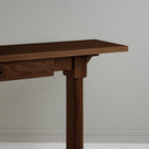  The design of the Keepsake Console Table is based on smoky stained oak, highlighting the texture and craftsmanship. 