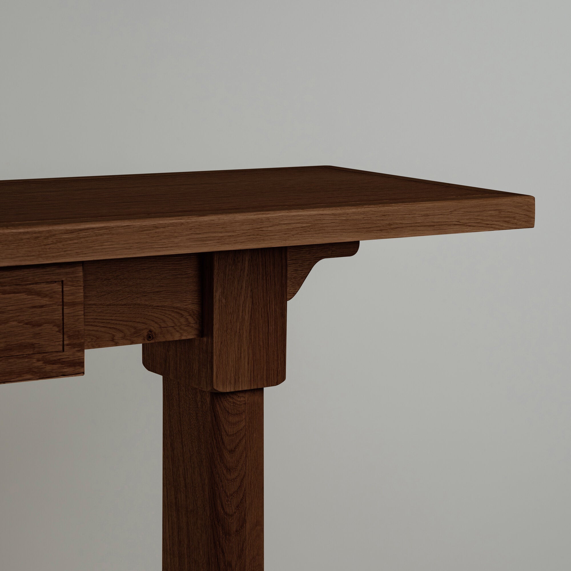  Design close-up of the Keepsake Console Table in smoky stained oak, highlighting the texture and craftsmanship. 