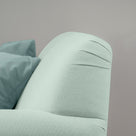  Backrest design closeup of Curtain Call Armchair in Laidback Linen Sky by NiX Furniture Studio, London. 