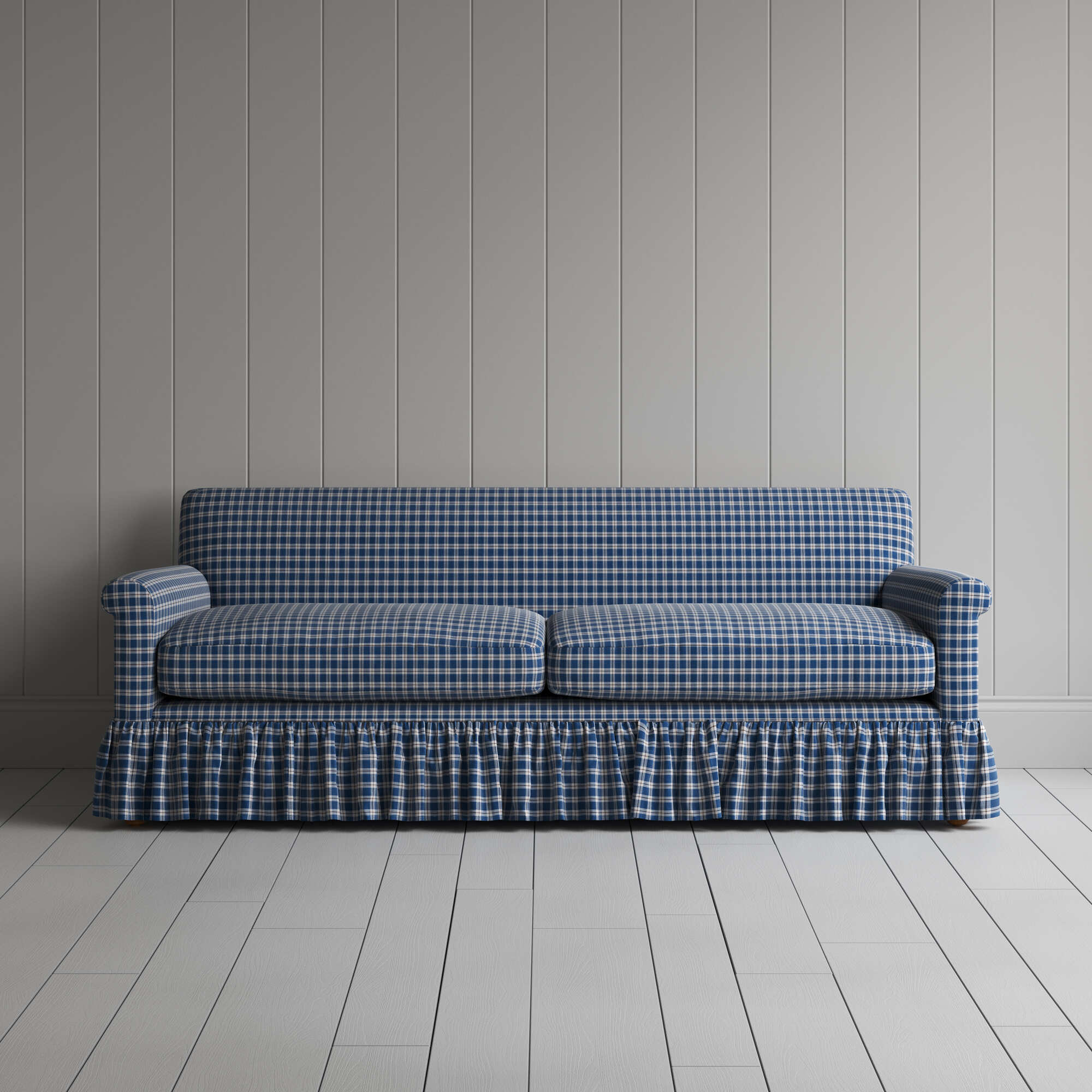  Blue and white checkered sofa with ruffled skirt, adding charm to any living room decor. 