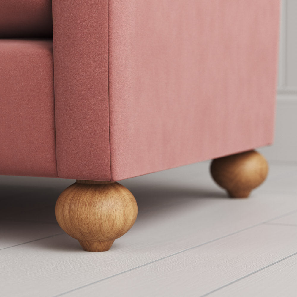  Detail of the distinctive spherical timber feet on the Dolittle sofa by NiX. 