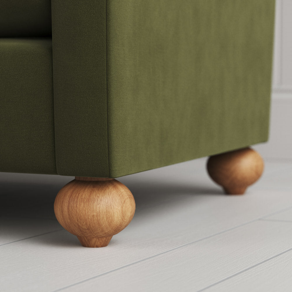  Zoomed shot of the solid wood ball foot on a Nicola Harding design sofa. 