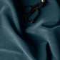 Velvet Aegean fabric in Blue color  with scissors.