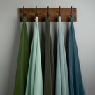  Velvet Fabric Swatches in Different Colors Hanging on Hooks – By NiX 