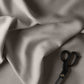 Image of plain cloth with scissors.