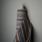  Mid-weight Organic Cotton, Regatta Charcoal, Fabric Roll Next to a Wall - Nicola Harding & Co. 
