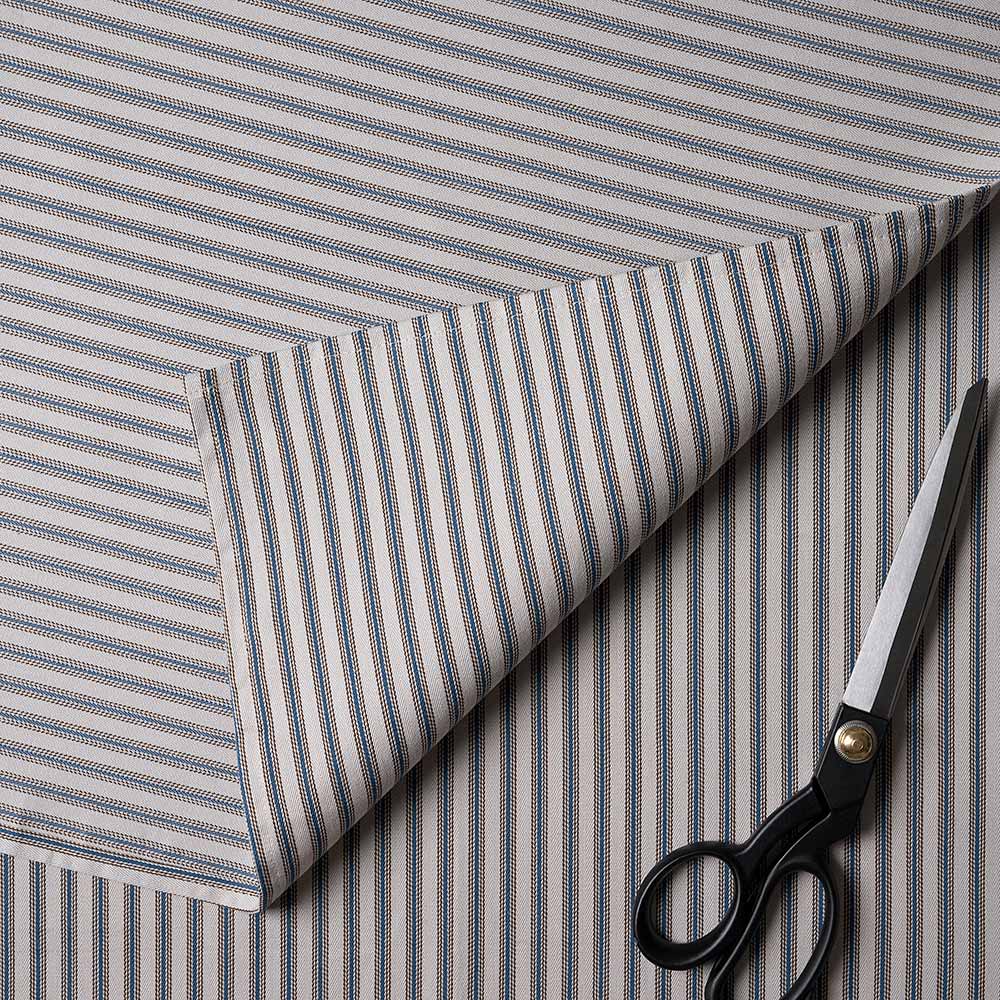  Scissors on a striped fabric. 