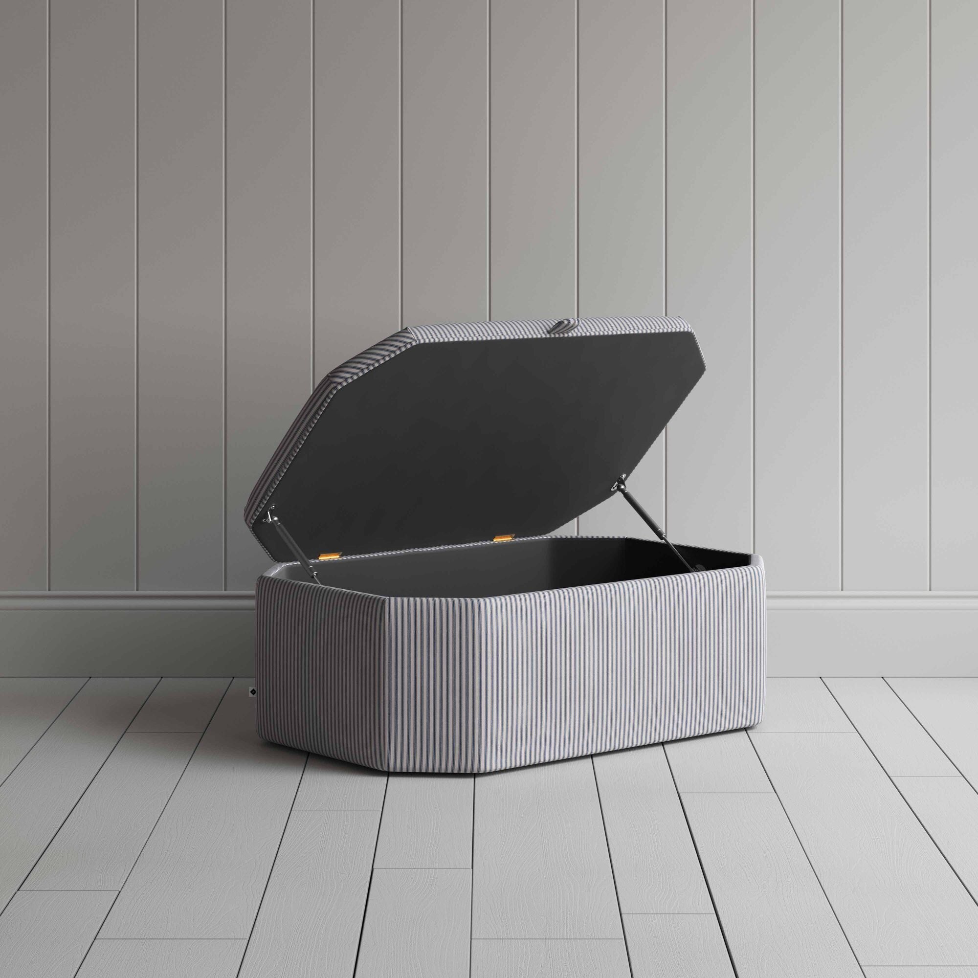  Stylish grey ottoman against white flooring. 