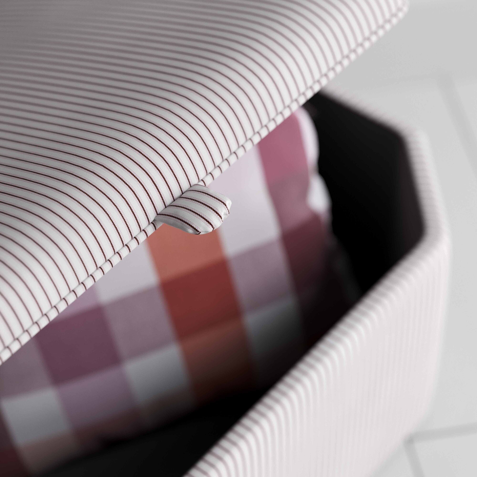 A close up of white and red striped ottoman. -NiX 
