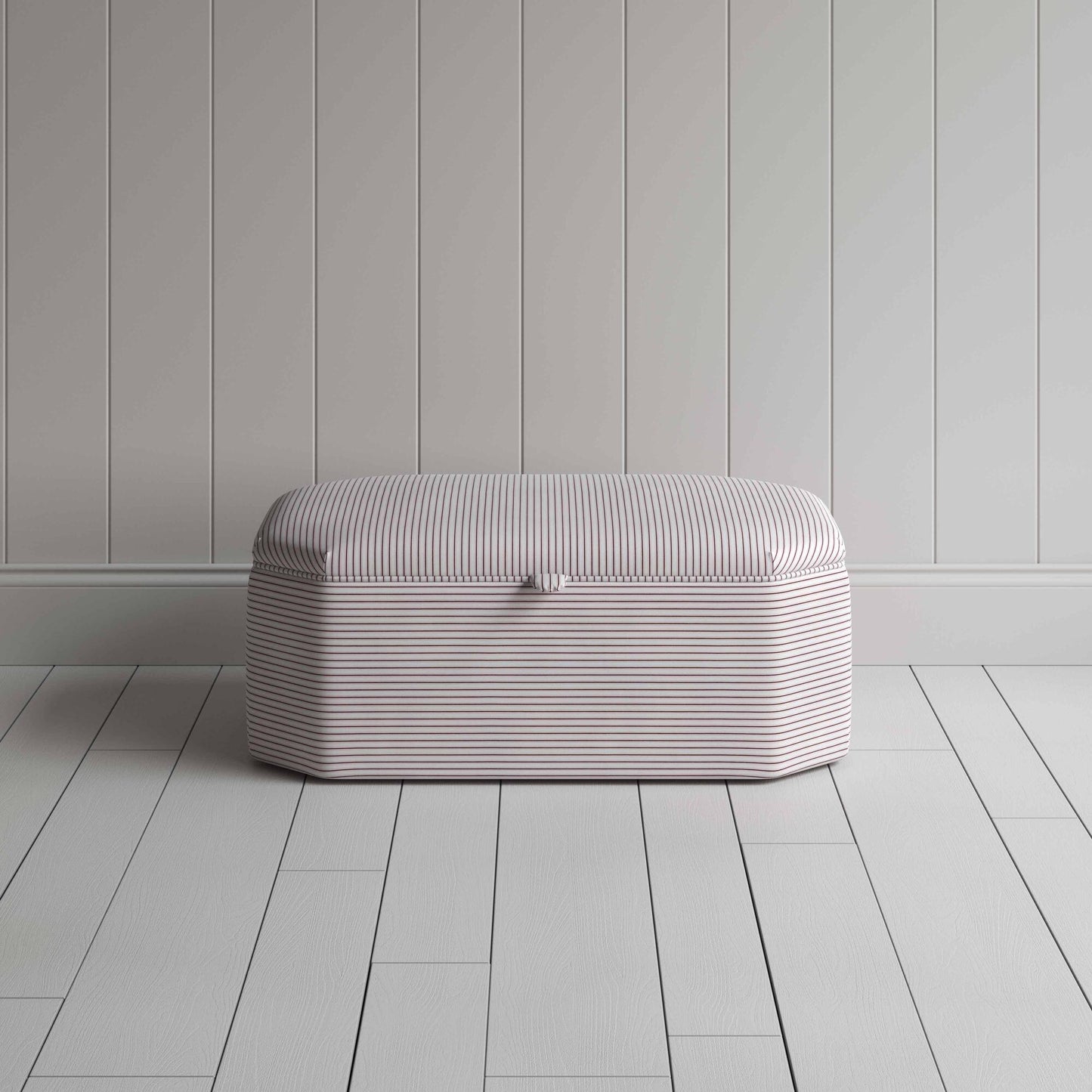 Stylish striped ottoman against white flooring.