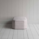  Stylish striped ottoman against white flooring. Side View - NiX 