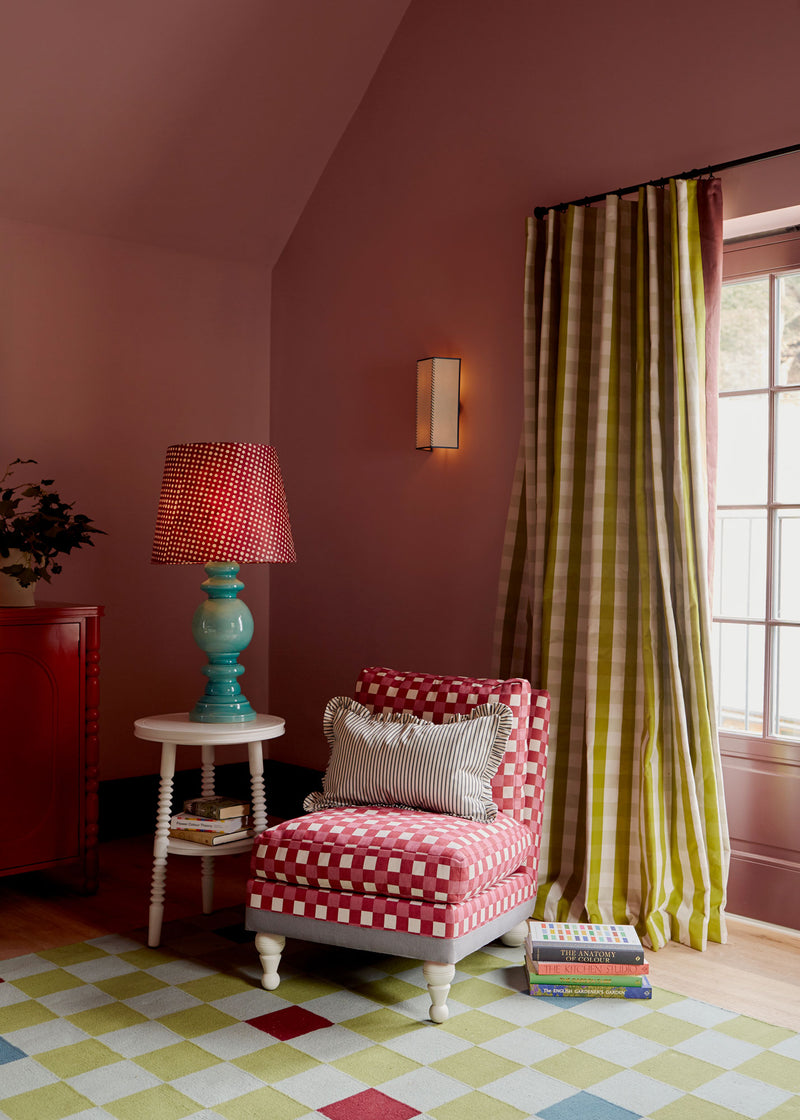 Interior with a chair and lamp, creating a cozy atmosphere.