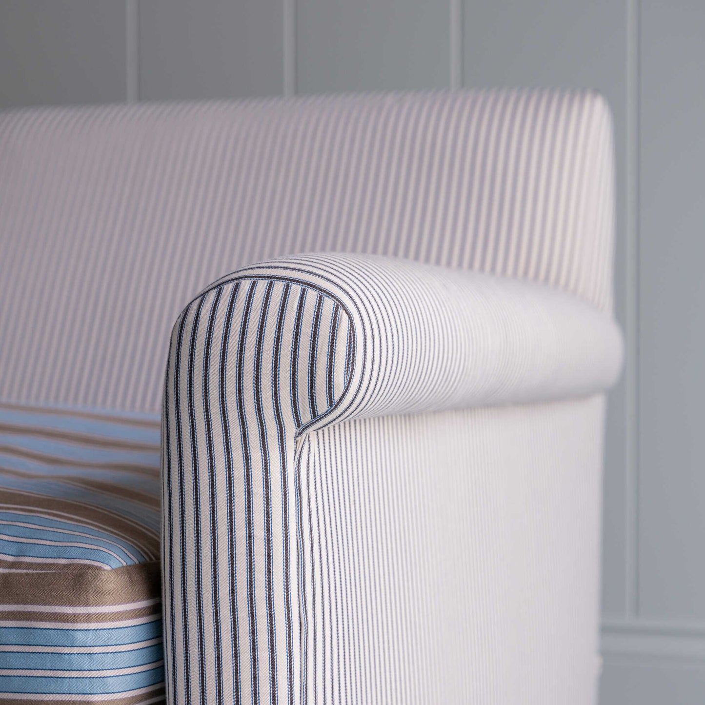 Arm Design Closeup of Idler 2 Seater Sofa in Ticking Cotton Chocolate Navy Frame and Regatta Blue Seat - Nicola Harding & Co.